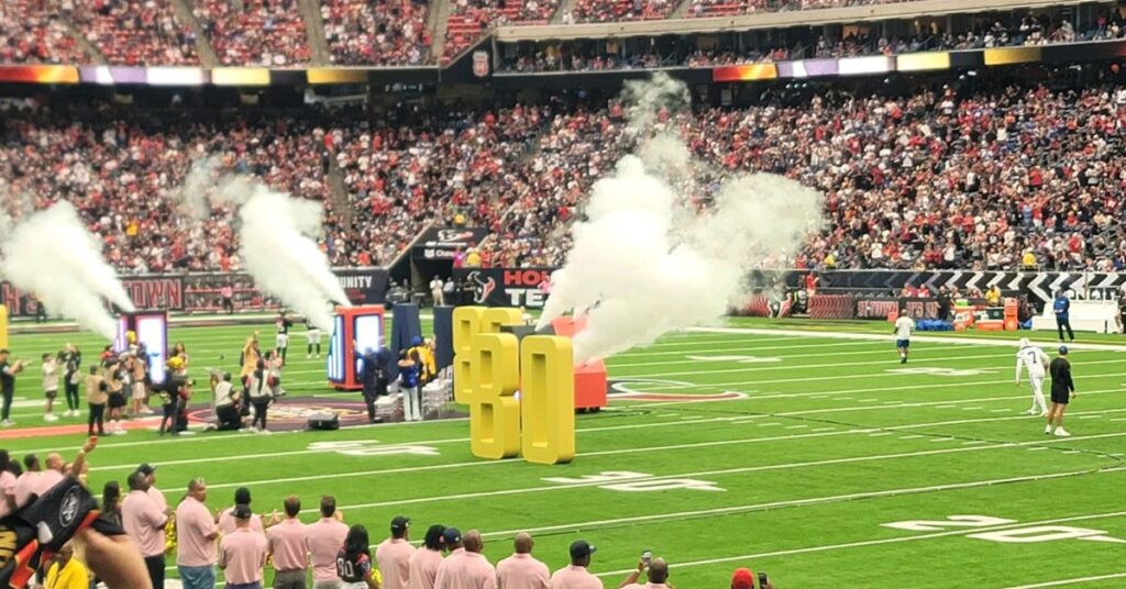 Giant foam sculptures by Smash Design on the field at an NFL game